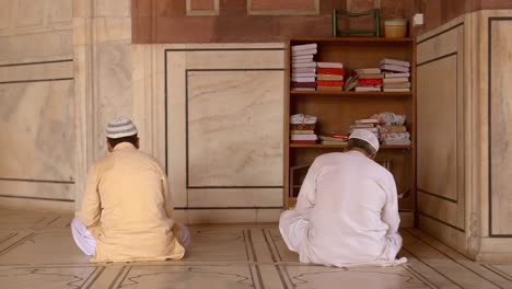 two worshippers in jama masjid