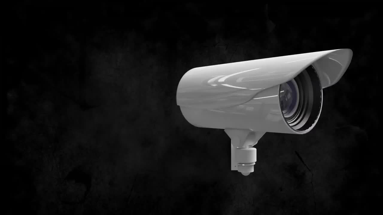 Animazione di una telecamera di sicurezza, con linee di interferenza, che si muove su sfondo nero.