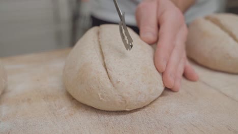 bread cutting techniques before fermentation in artisanal bakeries