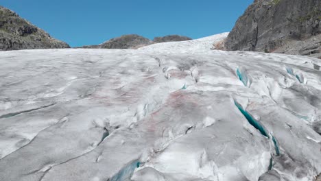 aerial: end of glacier melting and fracturing, global warming melting ice sheet