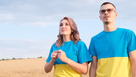extremely beautiful ukrainian family in embroidered dresses standing in a wheat field against extremely beautiful ukrainian family in embroidered dresses standing in a wheat field against the background of the sky ukrainian family dad mom and daughter photo session in the field
