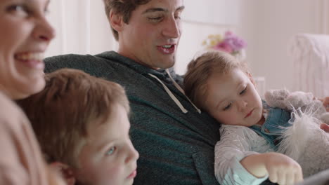 happy family using tablet computer at home mother and father with children watching entertainment playing game on touchscreen device learning having fun together 4k footage