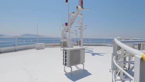 tilt up shot antennas and radar equipment on top of the bridge of a ferry boat, transportation technology