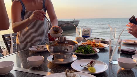 enjoying a meal by the ocean