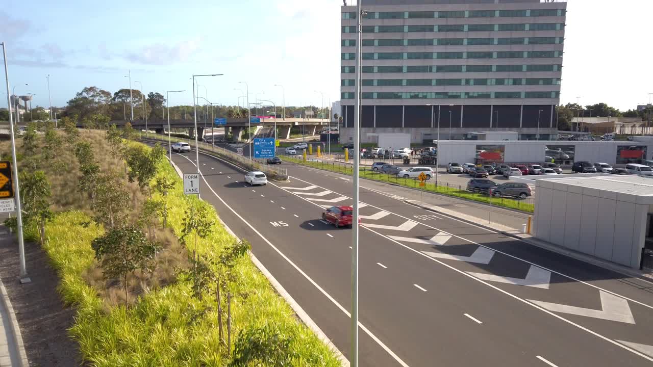 High angle shot of busy Sydney Kingsford Smith Airport Drive highway and express pickup car park. Australia