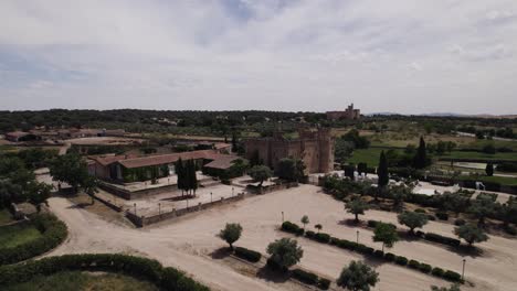 Castillo-de-Arguijuelas-de-Abajo,-a-historic-fortress-near-Cáceres,-Spain---Aerial-establishing-shot