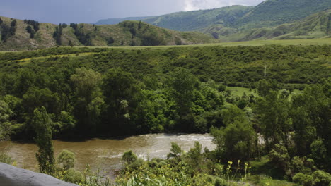 Vardzia-river-flowing-through-lush-green-fertile-valley-in-Georgia