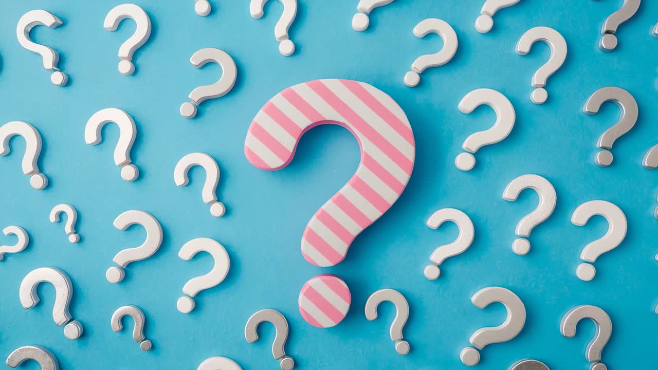 Showing pink white striped question mark centered on blue surface, with white-silver question marks