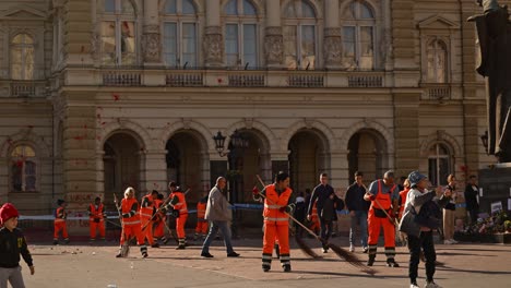 city workers cleaning up after a protest