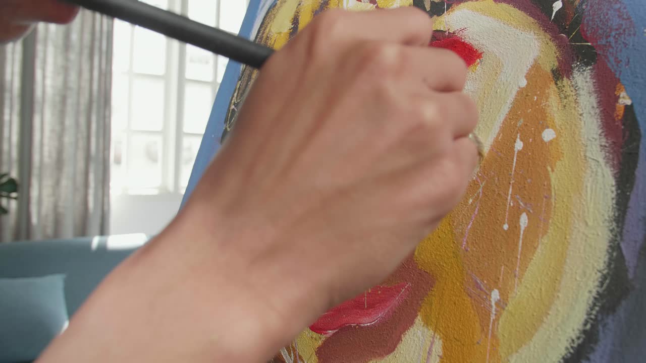 Close Up Of An Asian Artist Man Holding Paintbrush Mixed Colour And Painting A Girl'S Face On The Canvas