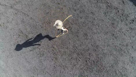 Mexican-charro--performing-rope-tricks-drone-view