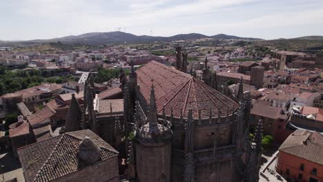 Aerial-view-orbiting-the-New-Cathedral-of-Plasencia-spires-overlooking-the-Spanish-Romanesque-skyline