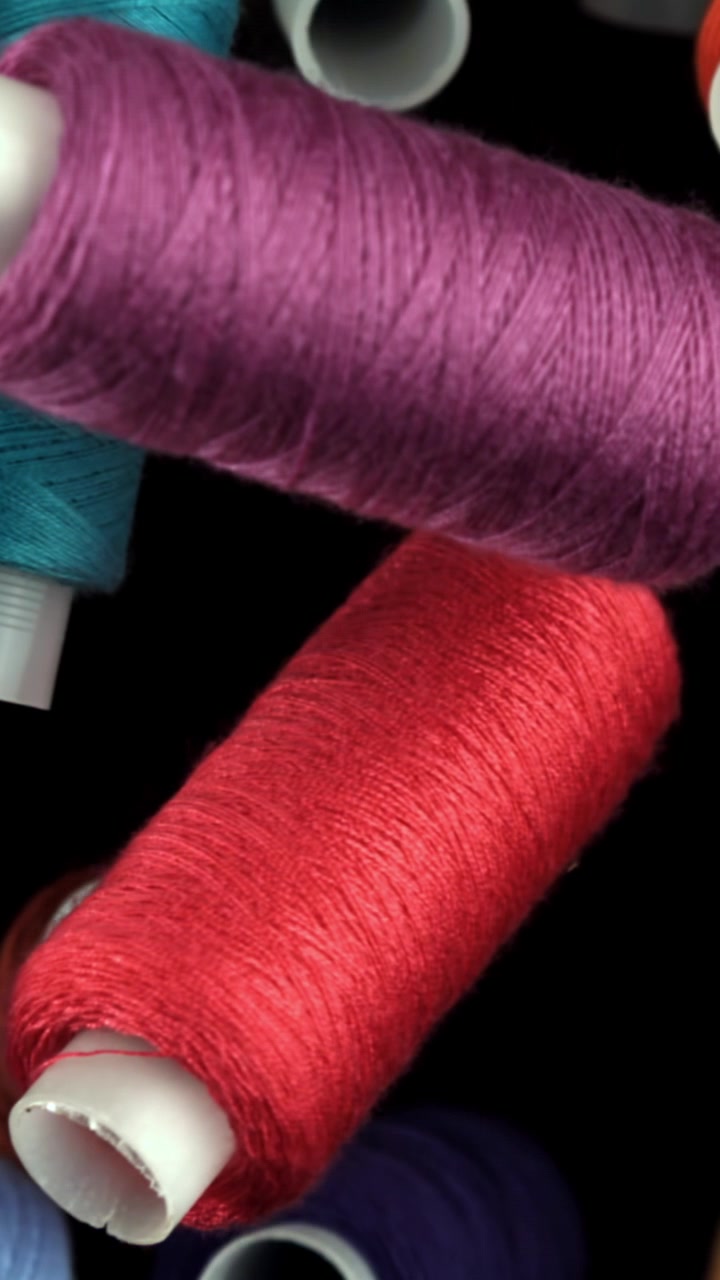 Colorful Sewing Thread Spools with Rack Focus