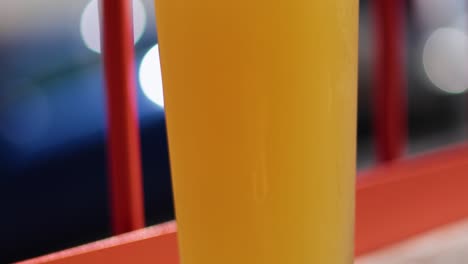 close-up of beer being poured into glass