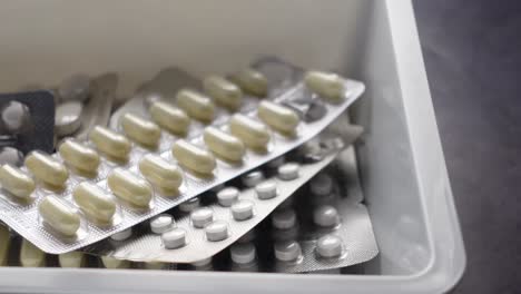 assorted medications in a storage container
