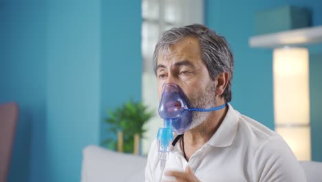 old man with chronic illness wears respirator.