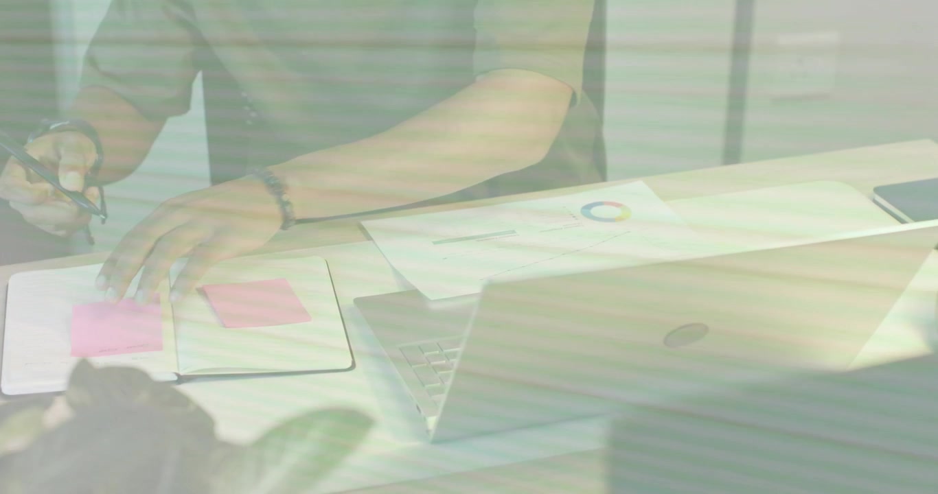 Man typing, checking pie chart, then sliding sheet, picking pen, marking pink notes for business