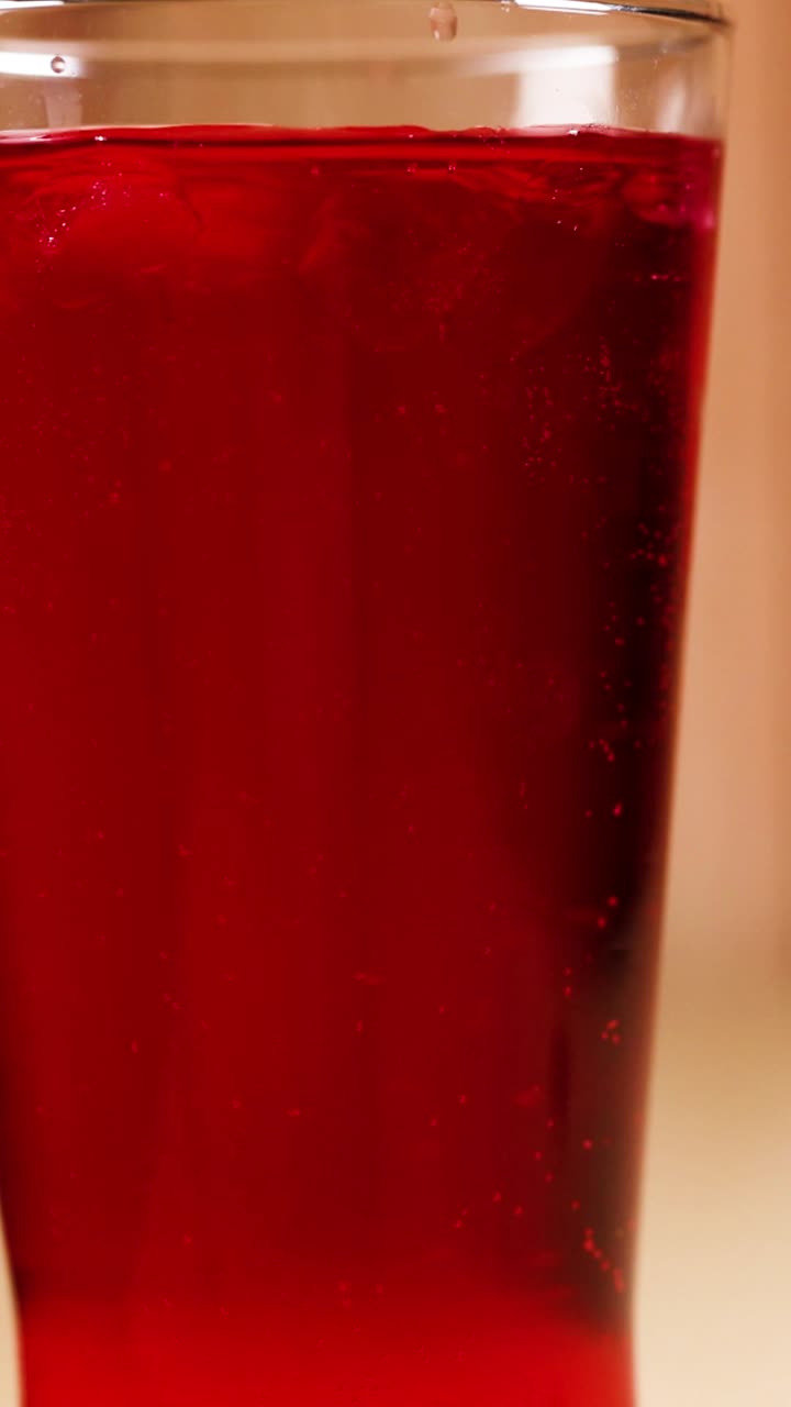 Red Drink in a Glass with Ice
