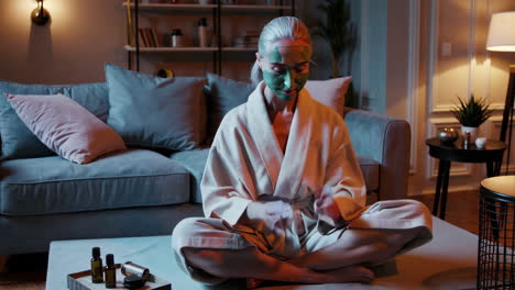 woman meditating with face mask in relaxing home environment