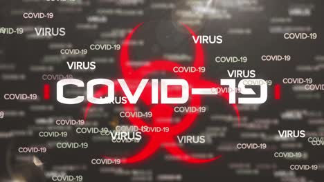 animación del texto de covid-19 y el símbolo de peligro biológico sobre fondo gris