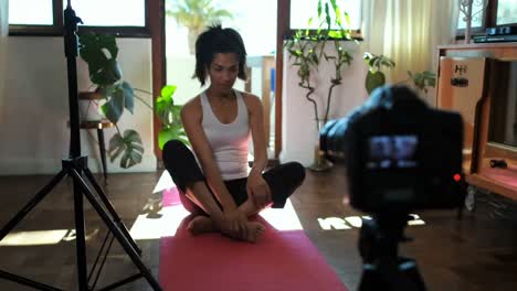 Female-video-blogger-recording-video-about-yoga-4k