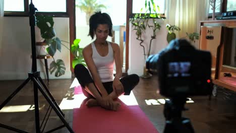 female video blogger recording video about yoga 4k