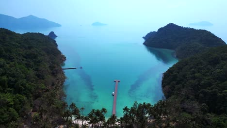 scenic aerial view of lush green hills and turquoise waters on koh chang ngam island. fantastic aerial view flight overflight flyover drone