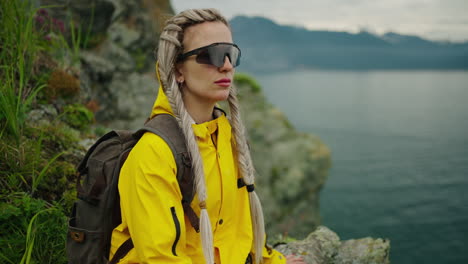 woman hiking by a lake