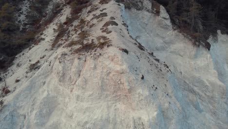 drone shot of quarry cliff in the forest