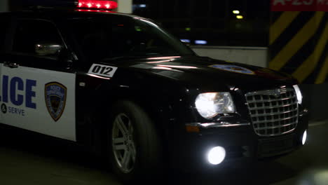 Police-vehicle-driving-on-bridge.-Police-officers-inspecting-area-in-patrol-car