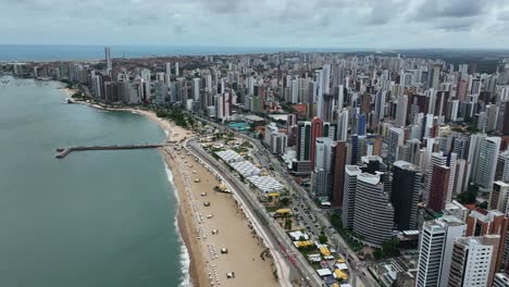 wide aerial view of fortaleza’s beach, with city skyline stretching along the coastline
