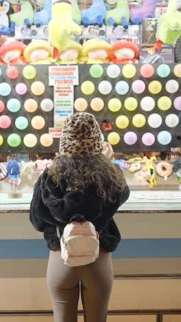 person playing a carnival game at a fair