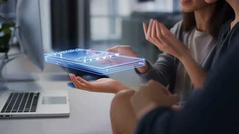 business professionals interacting with holographic projection