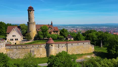 4k aerial drone video of the historic bamberg castle overlooking bamberg, germany on a beautiful spring day