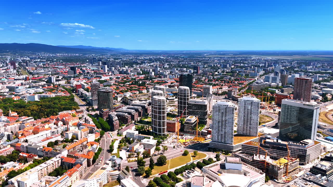 Combination of old and new architecture in the vast urban landscape. Aerial perspective on the scenery of Bratislava, Slovakia