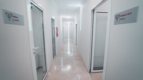 corridor in modern clinic. long hospital bright corridor with rooms