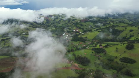 aerial panoramic view of a range of mountains of minas gerais during a a dense foggy day with a blue sky - mist day in the hills - minas gerais, serra da mantiqueira - brazil
