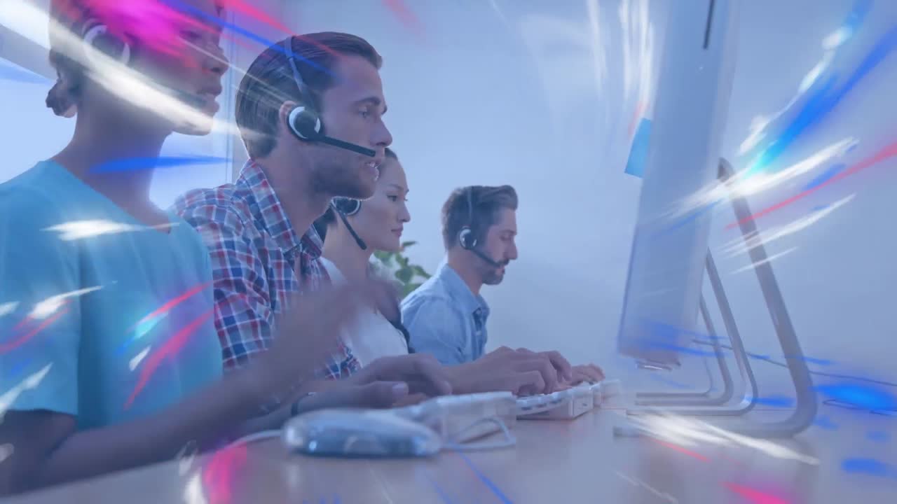 Animation of colorful glowing lights over business people wearing phone headsets