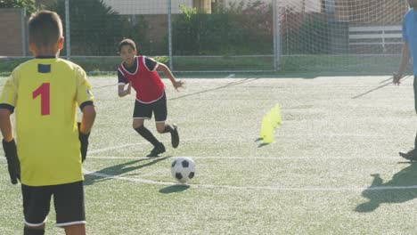 soccer kids exercising in a sunny day