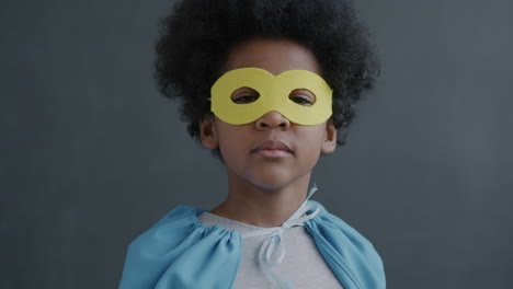 child dressed as superhero