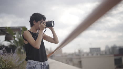 pro level female photographer clicking landscape photos at barcelona