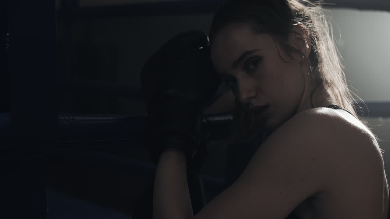 Female Boxer Resting in the Ring