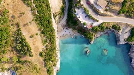 Orbiting-overhead-drone-shot-above-the-cliffs-of-Xigia,-a-secluded-cove-located-in-the-Greek-island-of-Zakynthos-in-t-he-Mediterranean-Sea