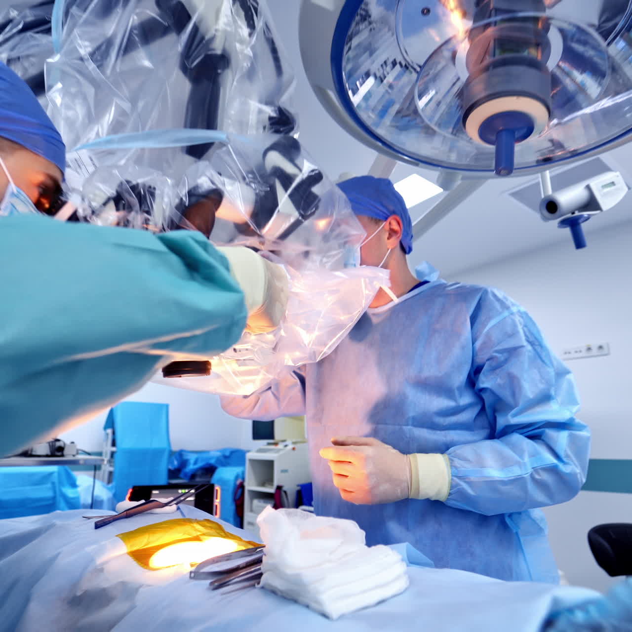 Ophthalmology operation. Surgeon's hands in gloves performing laser eye vision correction. ophthalmology , medicine, Vision correction with microscope.