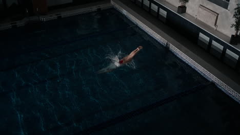 woman swimming in indoor swimming pool