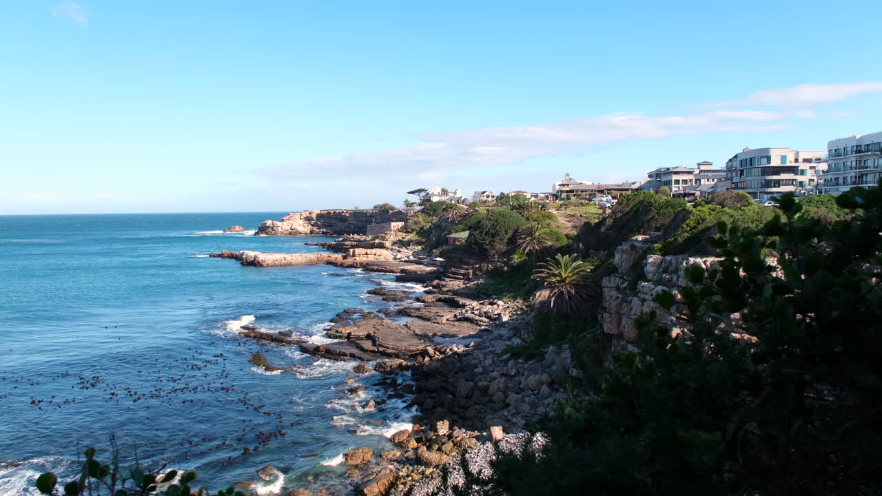 Sea cliffs of scenic seaside resort Hermanus overlooking Atlantic ocean, slider