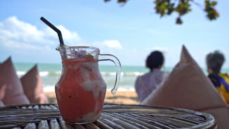 mango, pineapple, watermelon and yoghurt or yogurt smoothies jar with sea beach background