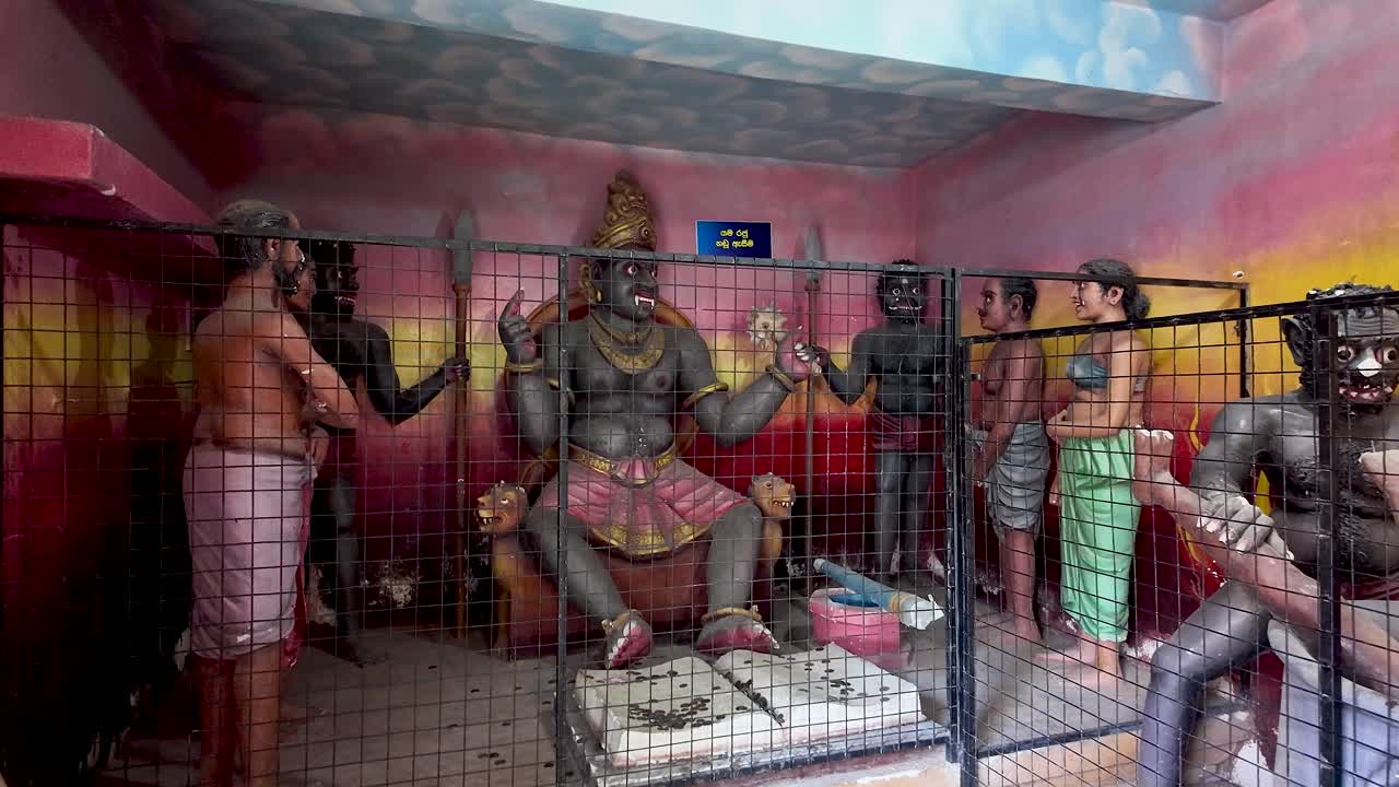 Intricately detailed statues illustrating a Buddhist representation of hell, located in a temple in Negombo, Sri Lanka, showcasing cultural and religious artistry.