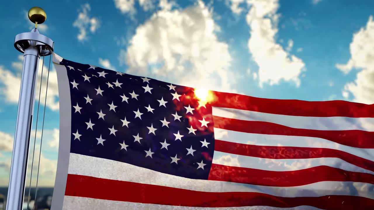 Un video ripreso dal basso della bandiera americana che sventola contro un cielo luminoso, a simboleggiare la libertà.