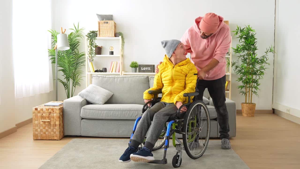 Man in wheelchair being assisted at home